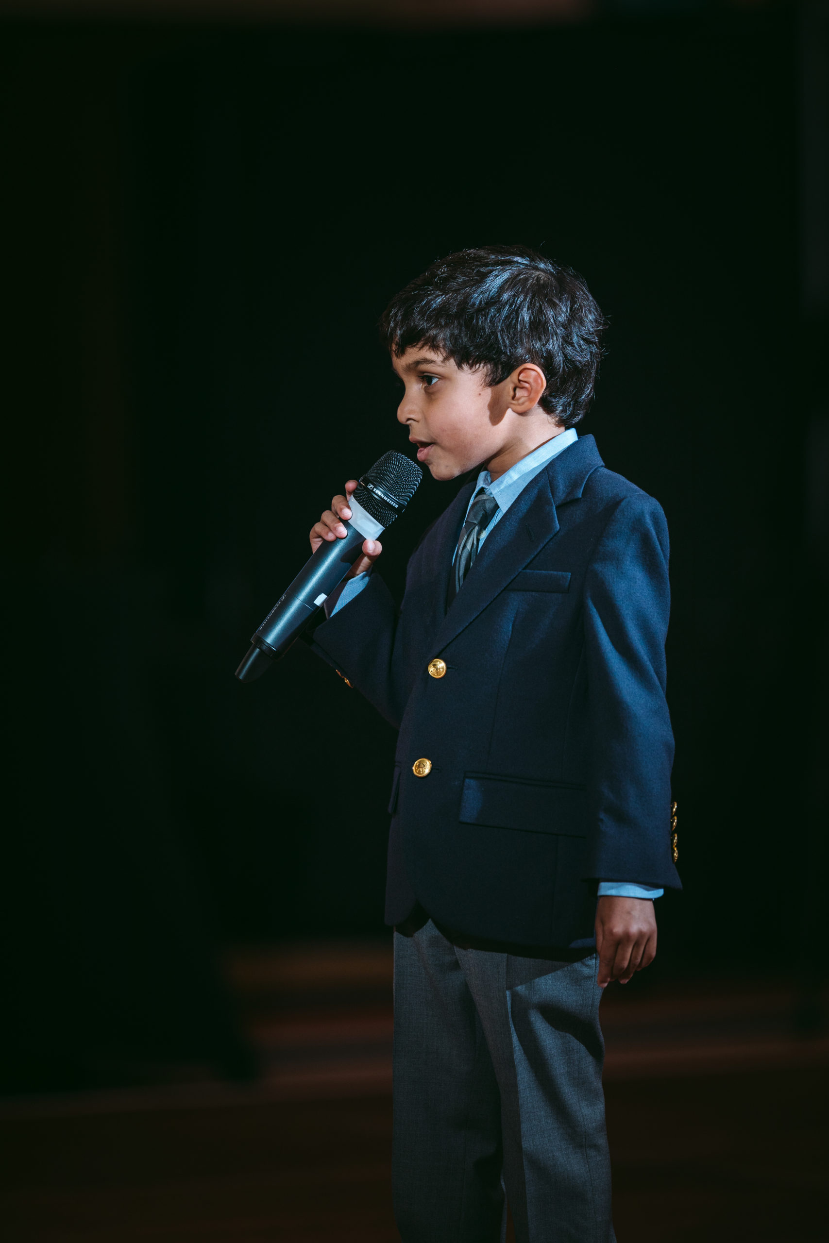 Young boy delivering a reception speech with great microphone placement
